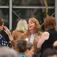 Lori Staggs chatting with two other colleagues